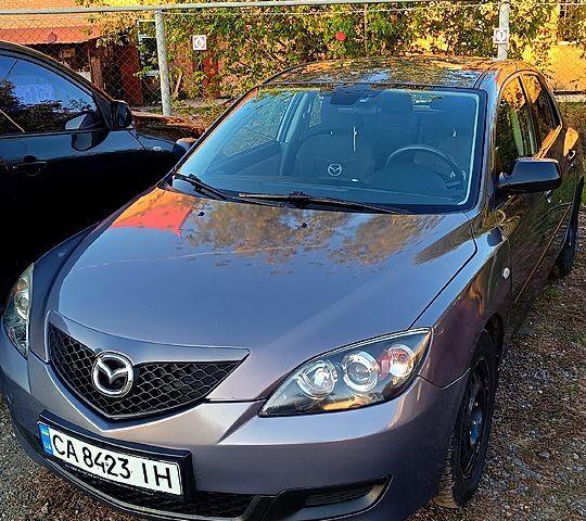 Серый Мазда 3, объемом двигателя 1.3 л и пробегом 221 тыс. км за 5000 $, фото 1 на Automoto.ua