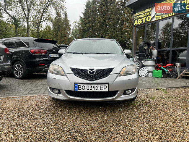 Серый Мазда 3, объемом двигателя 2 л и пробегом 242 тыс. км за 3400 $, фото 1 на Automoto.ua
