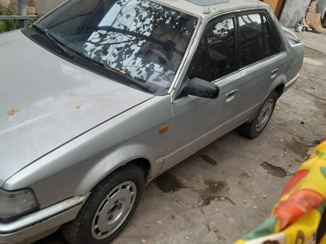 Серый Мазда 3, объемом двигателя 1.6 л и пробегом 330 тыс. км за 500 $, фото 1 на Automoto.ua