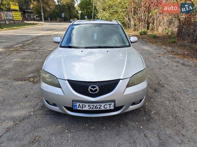 Серый Мазда 3, объемом двигателя 2 л и пробегом 250 тыс. км за 3600 $, фото 1 на Automoto.ua
