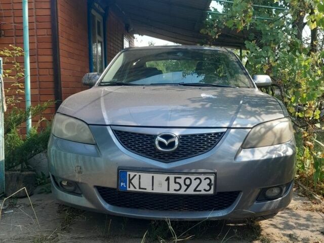 Серый Мазда 3, объемом двигателя 1 л и пробегом 330 тыс. км за 2607 $, фото 1 на Automoto.ua