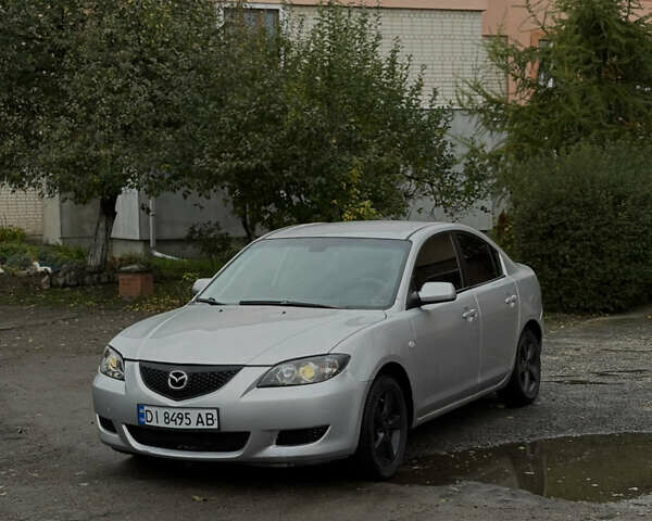 Серый Мазда 3, объемом двигателя 2 л и пробегом 229 тыс. км за 4000 $, фото 1 на Automoto.ua