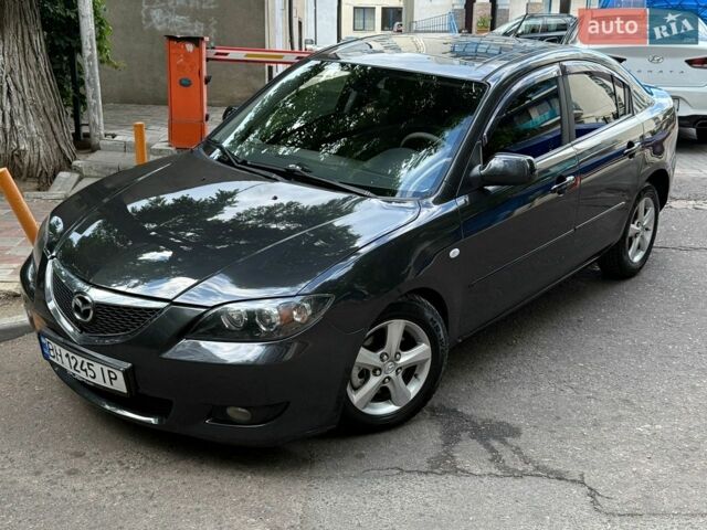 Серый Мазда 3, объемом двигателя 1.6 л и пробегом 245 тыс. км за 4600 $, фото 1 на Automoto.ua