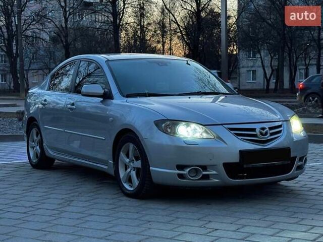 Сірий Мазда 3, об'ємом двигуна 2 л та пробігом 206 тис. км за 2999 $, фото 1 на Automoto.ua