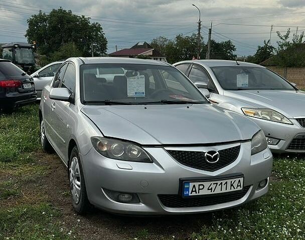 Серый Мазда 3, объемом двигателя 1.6 л и пробегом 305 тыс. км за 3900 $, фото 1 на Automoto.ua
