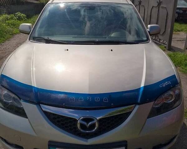 Серый Мазда 3, объемом двигателя 1.6 л и пробегом 186 тыс. км за 5000 $, фото 1 на Automoto.ua