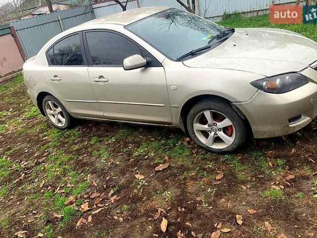 Серый Мазда 3, объемом двигателя 2 л и пробегом 307 тыс. км за 5250 $, фото 1 на Automoto.ua