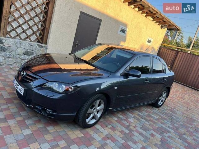 Серый Мазда 3, объемом двигателя 1.6 л и пробегом 196 тыс. км за 6000 $, фото 1 на Automoto.ua