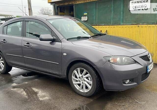 Серый Мазда 3, объемом двигателя 2 л и пробегом 129 тыс. км за 6300 $, фото 1 на Automoto.ua
