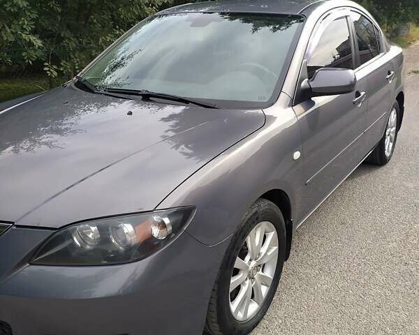 Серый Мазда 3, объемом двигателя 1.6 л и пробегом 134 тыс. км за 6700 $, фото 1 на Automoto.ua