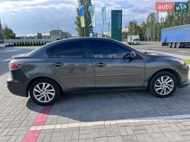 Серый Мазда 3, объемом двигателя 2 л и пробегом 298 тыс. км за 7000 $, фото 1 на Automoto.ua