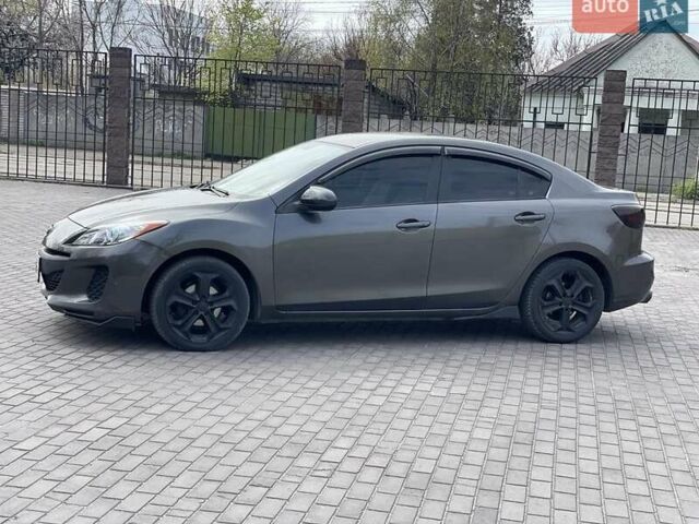 Серый Мазда 3, объемом двигателя 2 л и пробегом 210 тыс. км за 7300 $, фото 1 на Automoto.ua