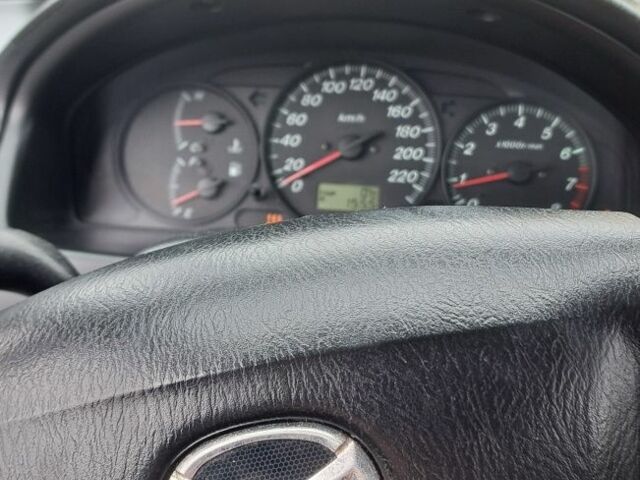 Серый Мазда 3, объемом двигателя 1.6 л и пробегом 245 тыс. км за 1450 $, фото 1 на Automoto.ua