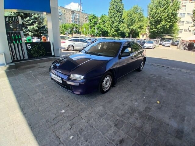 Синій Мазда 3, об'ємом двигуна 1.5 л та пробігом 250 тис. км за 1400 $, фото 1 на Automoto.ua