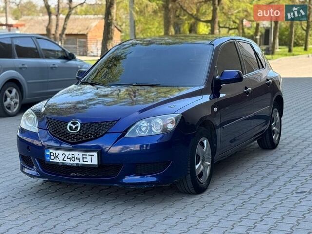Синий Мазда 3, объемом двигателя 1.4 л и пробегом 250 тыс. км за 3450 $, фото 1 на Automoto.ua