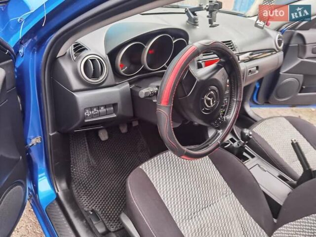 Синий Мазда 3, объемом двигателя 1.56 л и пробегом 253 тыс. км за 4200 $, фото 1 на Automoto.ua