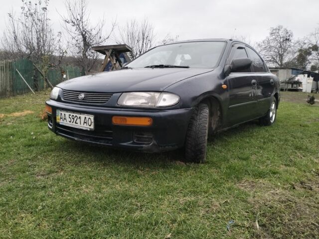 Синий Мазда 3, объемом двигателя 1.5 л и пробегом 260 тыс. км за 1300 $, фото 1 на Automoto.ua