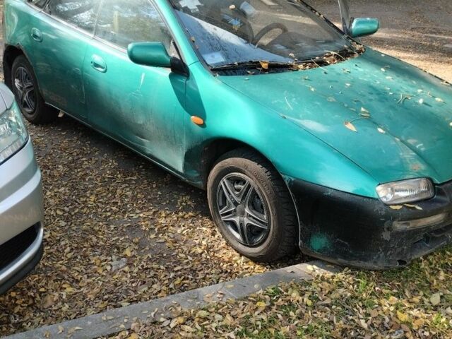 Зелений Мазда 3, об'ємом двигуна 1.8 л та пробігом 237 тис. км за 716 $, фото 1 на Automoto.ua