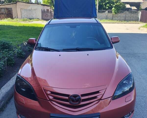 Оранжевый Мазда 3, объемом двигателя 1.6 л и пробегом 253 тыс. км за 5700 $, фото 1 на Automoto.ua