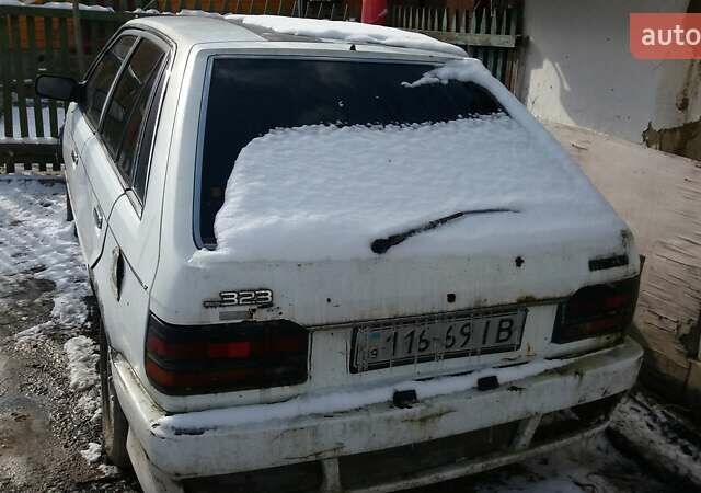 Белый Мазда 323, объемом двигателя 1.5 л и пробегом 333 тыс. км за 300 $, фото 1 на Automoto.ua