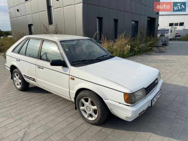 Білий Мазда 323, об'ємом двигуна 1.5 л та пробігом 230 тис. км за 849 $, фото 1 на Automoto.ua