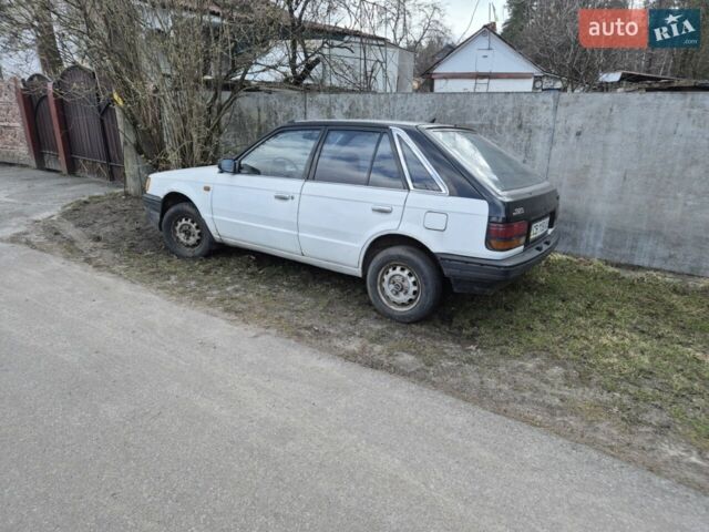 Білий Мазда 323, об'ємом двигуна 1.3 л та пробігом 100 тис. км за 500 $, фото 1 на Automoto.ua