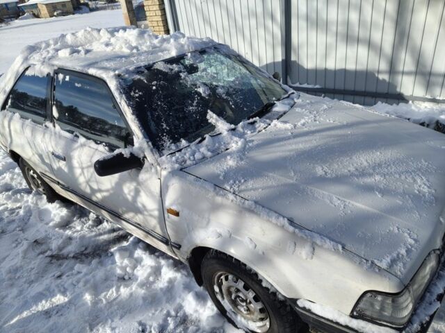 Белый Мазда 323, объемом двигателя 1.5 л и пробегом 360 тыс. км за 350 $, фото 1 на Automoto.ua