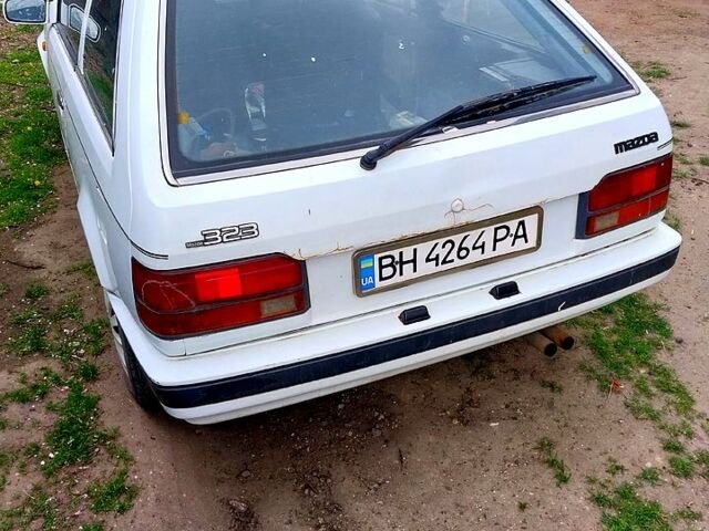 Білий Мазда 323, об'ємом двигуна 1.5 л та пробігом 350 тис. км за 599 $, фото 1 на Automoto.ua