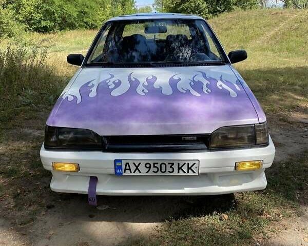 Білий Мазда 323, об'ємом двигуна 1.32 л та пробігом 350 тис. км за 900 $, фото 1 на Automoto.ua