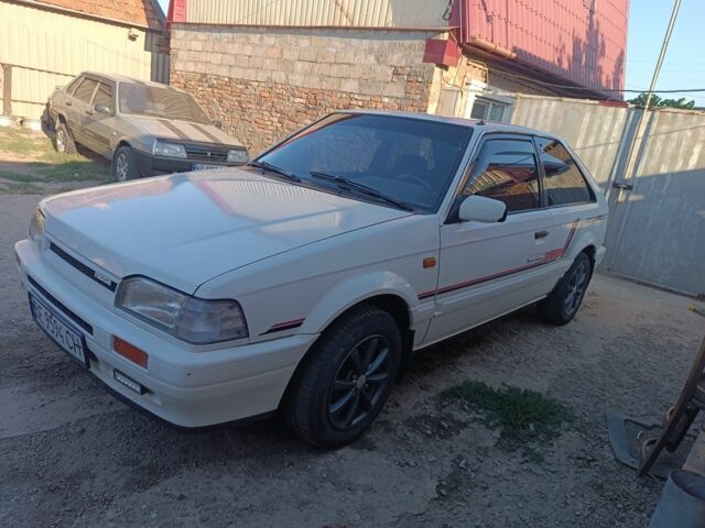Белый Мазда 323, объемом двигателя 1.6 л и пробегом 200 тыс. км за 1350 $, фото 1 на Automoto.ua