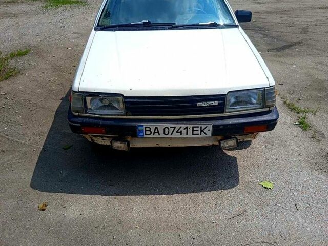 Белый Мазда 323, объемом двигателя 1.7 л и пробегом 300 тыс. км за 720 $, фото 1 на Automoto.ua