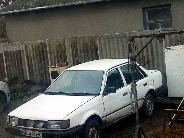 Белый Мазда 323, объемом двигателя 1.7 л и пробегом 1000 тыс. км за 800 $, фото 1 на Automoto.ua