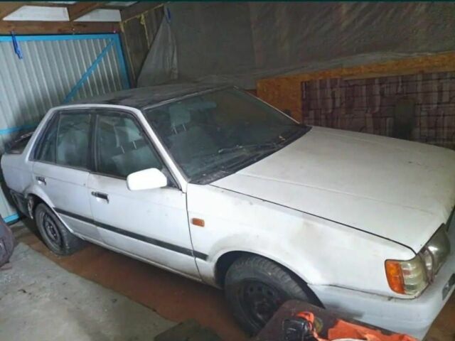 Белый Мазда 323, объемом двигателя 1 л и пробегом 200 тыс. км за 348 $, фото 1 на Automoto.ua