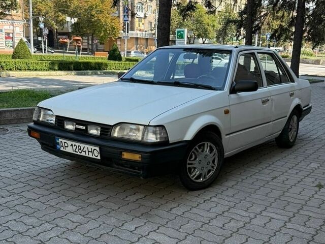 Білий Мазда 323, об'ємом двигуна 1.3 л та пробігом 287 тис. км за 850 $, фото 1 на Automoto.ua