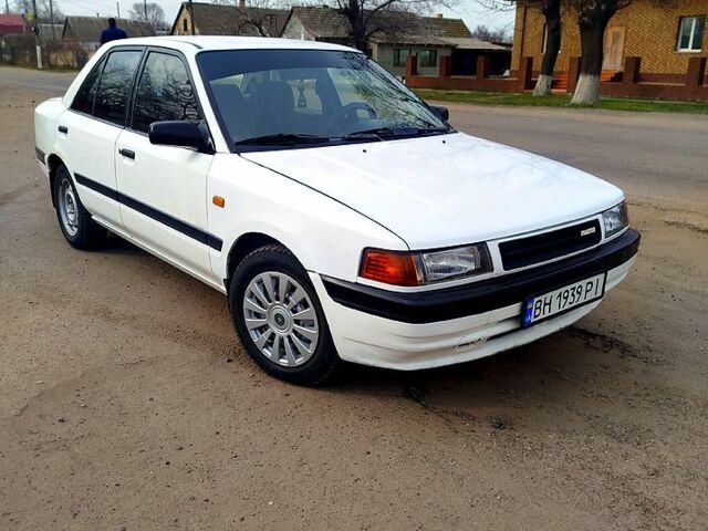 Білий Мазда 323, об'ємом двигуна 1.8 л та пробігом 88 тис. км за 1500 $, фото 1 на Automoto.ua
