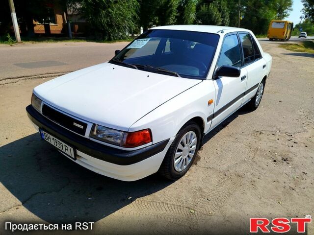 Білий Мазда 323, об'ємом двигуна 1.8 л та пробігом 89 тис. км за 1550 $, фото 1 на Automoto.ua