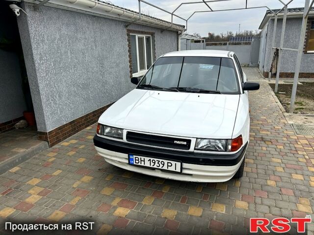Белый Мазда 323, объемом двигателя 1.8 л и пробегом 0 тыс. км за 2000 $, фото 1 на Automoto.ua