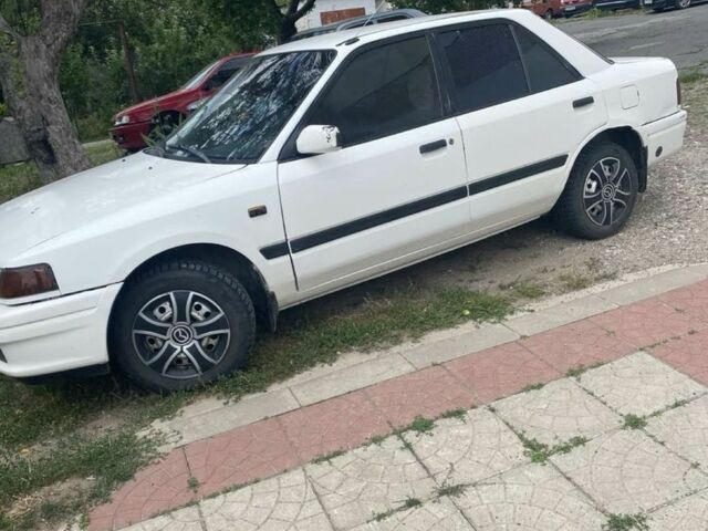 Білий Мазда 323, об'ємом двигуна 1.6 л та пробігом 300 тис. км за 1155 $, фото 1 на Automoto.ua