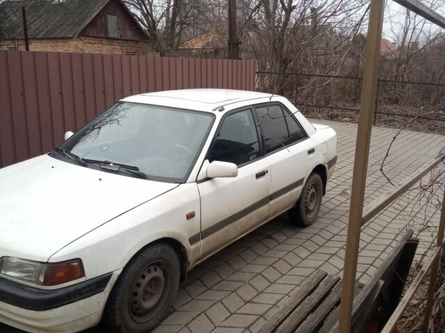 Белый Мазда 323, объемом двигателя 1 л и пробегом 335 тыс. км за 1200 $, фото 1 на Automoto.ua