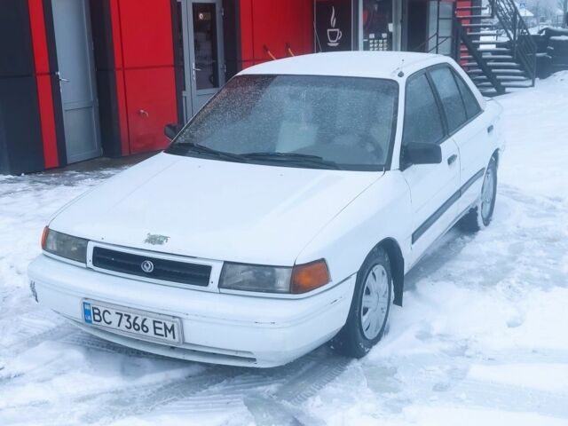 Белый Мазда 323, объемом двигателя 1.8 л и пробегом 250 тыс. км за 650 $, фото 1 на Automoto.ua