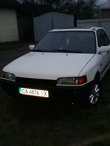 Белый Мазда 323, объемом двигателя 1.7 л и пробегом 470 тыс. км за 2500 $, фото 1 на Automoto.ua