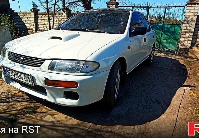 Белый Мазда 323, объемом двигателя 15 л и пробегом 480 тыс. км за 2200 $, фото 1 на Automoto.ua