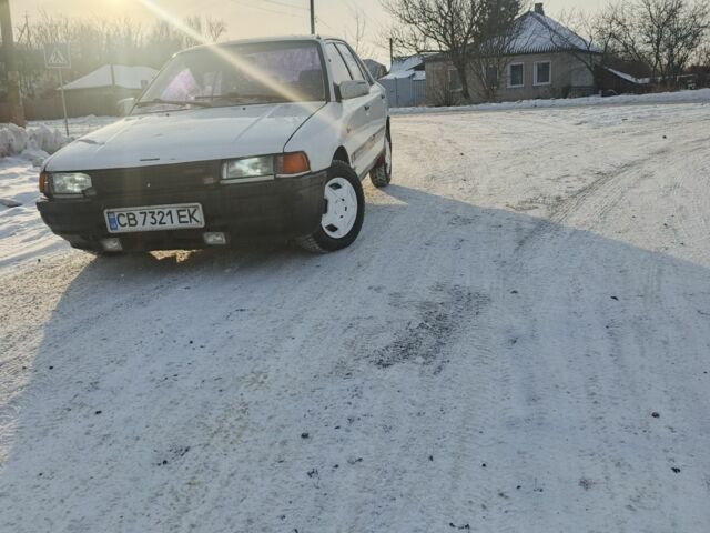 Белый Мазда 323, объемом двигателя 1.3 л и пробегом 1 тыс. км за 1000 $, фото 1 на Automoto.ua