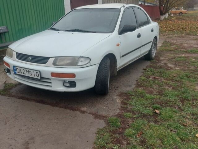 Белый Мазда 323, объемом двигателя 1.5 л и пробегом 330 тыс. км за 1850 $, фото 1 на Automoto.ua