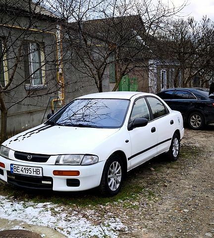 Белый Мазда 323, объемом двигателя 1.5 л и пробегом 398 тыс. км за 1650 $, фото 1 на Automoto.ua