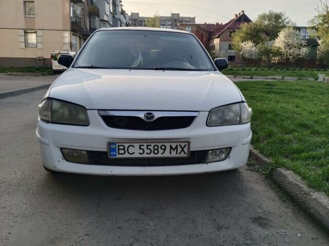 Белый Мазда 323, объемом двигателя 2 л и пробегом 280 тыс. км за 2300 $, фото 1 на Automoto.ua