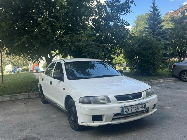 Белый Мазда 323, объемом двигателя 1.5 л и пробегом 235 тыс. км за 1346 $, фото 1 на Automoto.ua