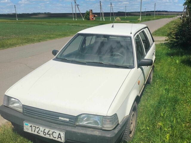 Белый Мазда 323, объемом двигателя 0 л и пробегом 100 тыс. км за 700 $, фото 1 на Automoto.ua