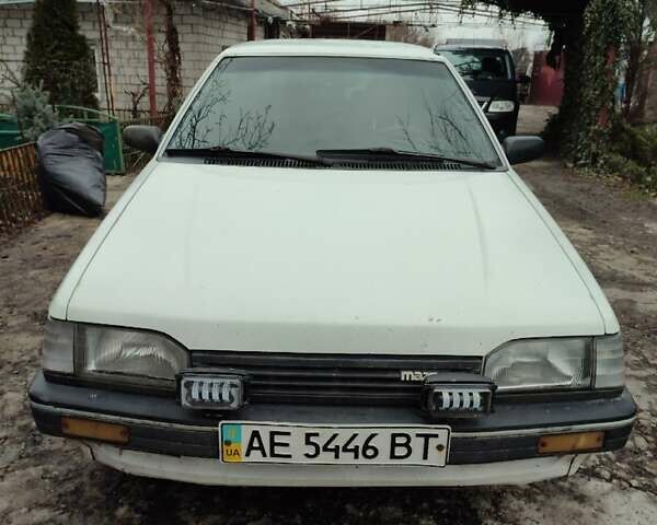 Белый Мазда 323, объемом двигателя 1.5 л и пробегом 177 тыс. км за 1500 $, фото 1 на Automoto.ua