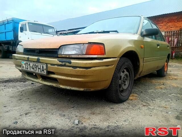 Бежевий Мазда 323, об'ємом двигуна 1.5 л та пробігом 500 тис. км за 740 $, фото 1 на Automoto.ua
